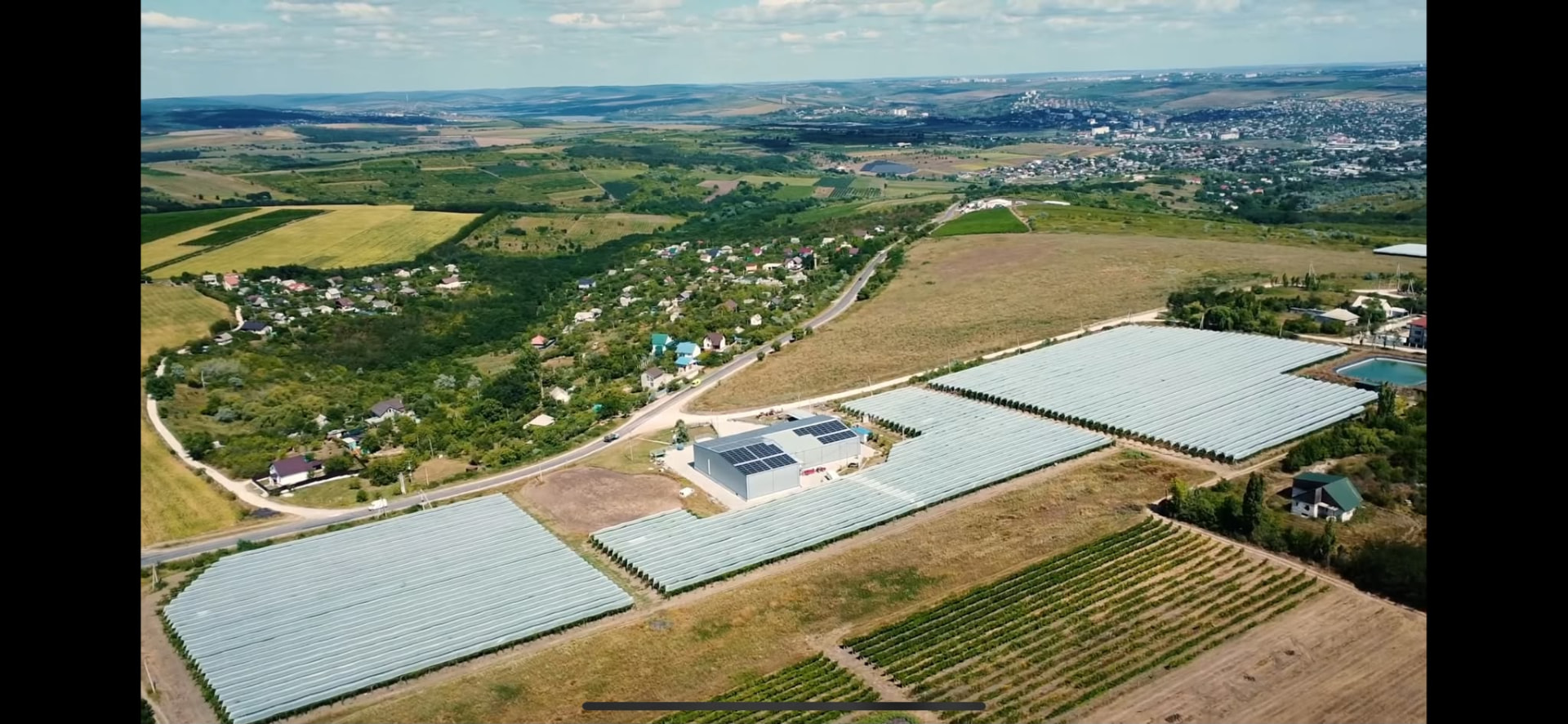 Aerial view of the Frudova greenhouse site where HARVIX robots are tested